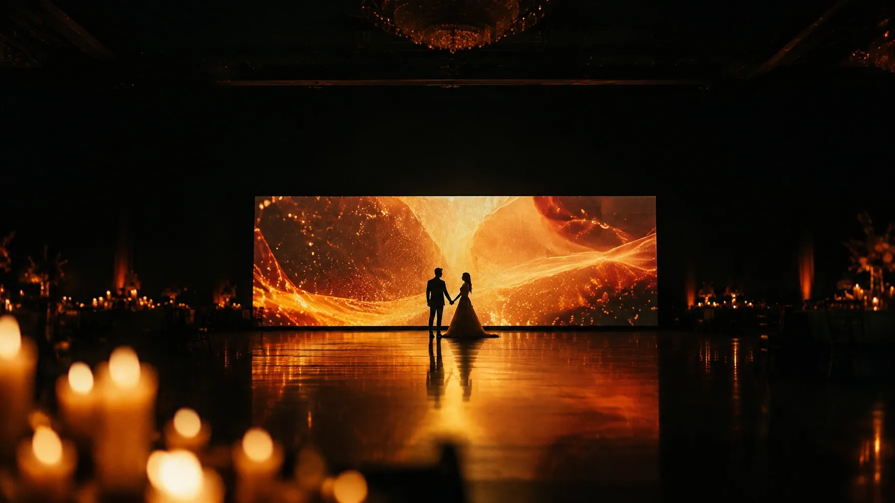Newlyweds on a glowing wedding dance floor